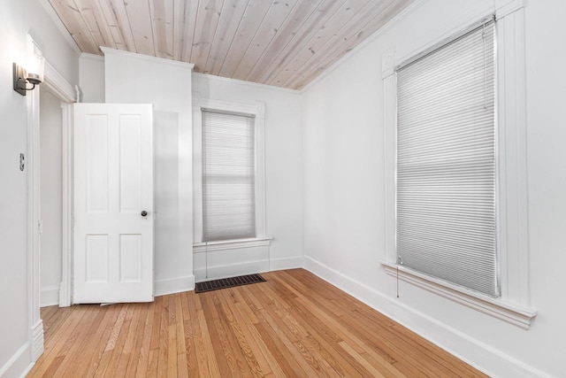 616 Elk St, Sabula, IA 52070 - unfurnished room featuring light wood-type flooring, wooden ceiling, and ornamental molding