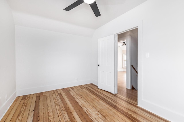 616 Elk St, Sabula, IA 52070 - spare room featuring hardwood / wood-style flooring, ceiling fan, and vaulted ceiling