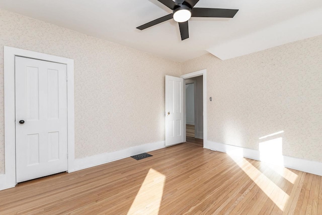 616 Elk St, Sabula, IA 52070 - empty room featuring light hardwood / wood-style flooring and ceiling fan