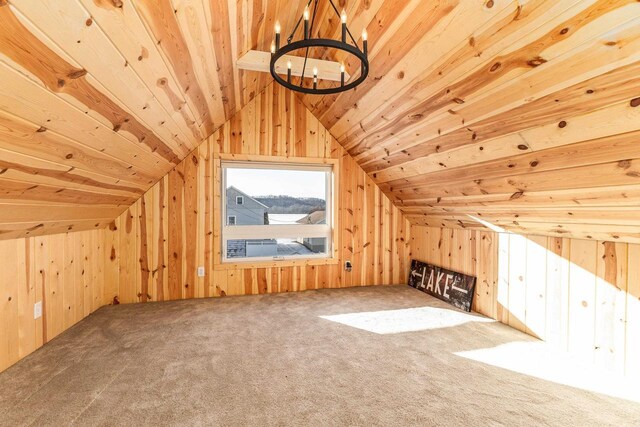 616 Elk St, Sabula, IA 52070 - additional living space featuring carpet, lofted ceiling, wooden ceiling, and wood walls