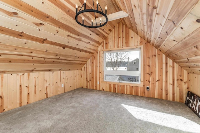 616 Elk St, Sabula, IA 52070 - additional living space with vaulted ceiling, wooden ceiling, wood walls, and carpet floors