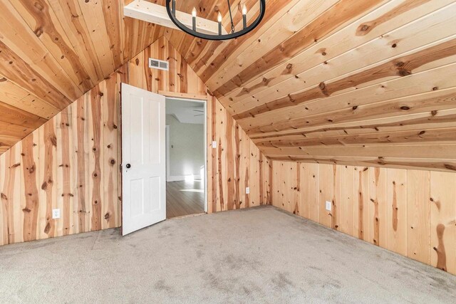 616 Elk St, Sabula, IA 52070 - bonus room featuring wood ceiling, wooden walls, and carpet floors