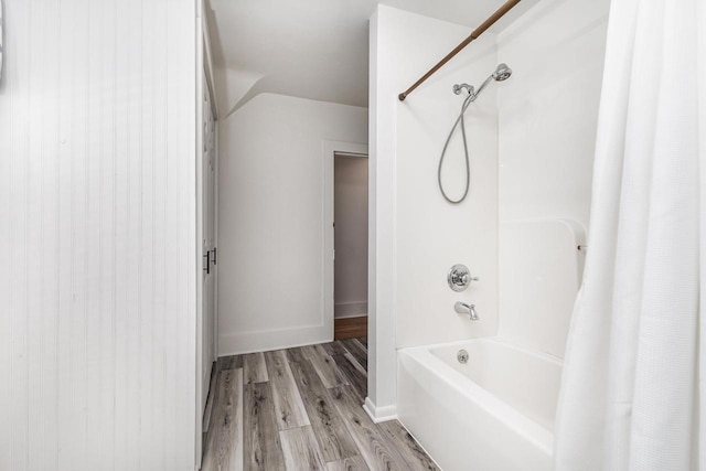 616 Elk St, Sabula, IA 52070 - bathroom with shower / tub combo with curtain and hardwood / wood-style flooring