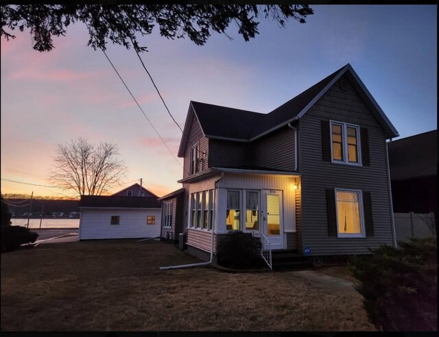 616 Elk St, Sabula, IA 52070 - view of back house at dusk