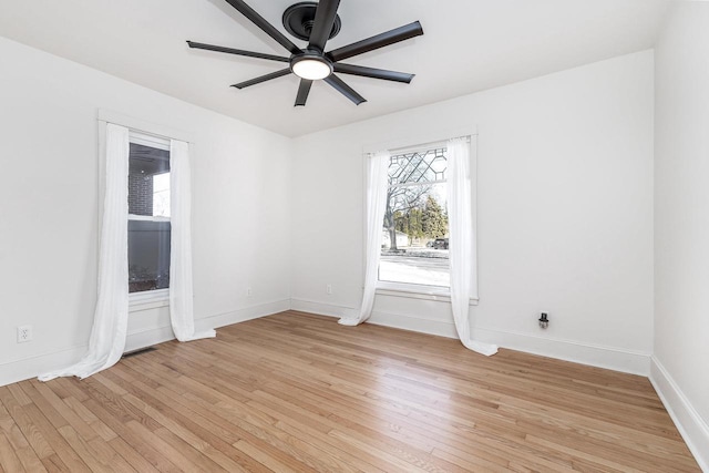 616 Elk St, Sabula, IA 52070 - unfurnished room featuring ceiling fan and light hardwood / wood-style floors