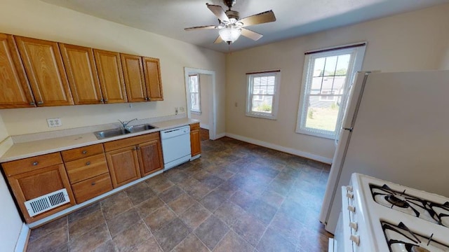 kitchen with ceiling fan, sink, and white appliances