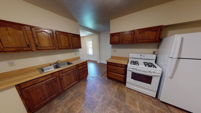 kitchen with white appliances and sink