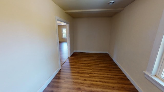 corridor featuring dark hardwood / wood-style flooring