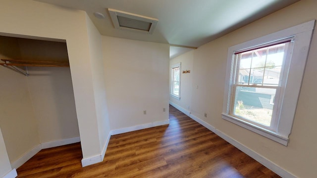 interior space featuring dark hardwood / wood-style floors and plenty of natural light