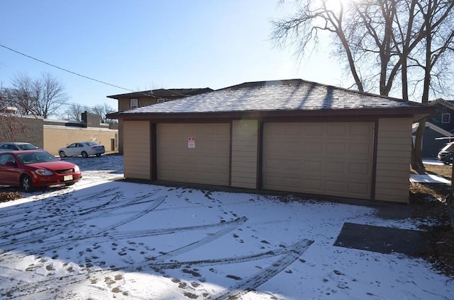 view of snow covered garage