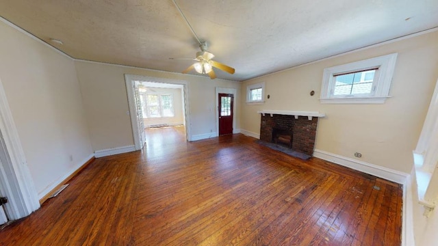 unfurnished living room featuring ceiling fan, a fireplace, and wood-type flooring