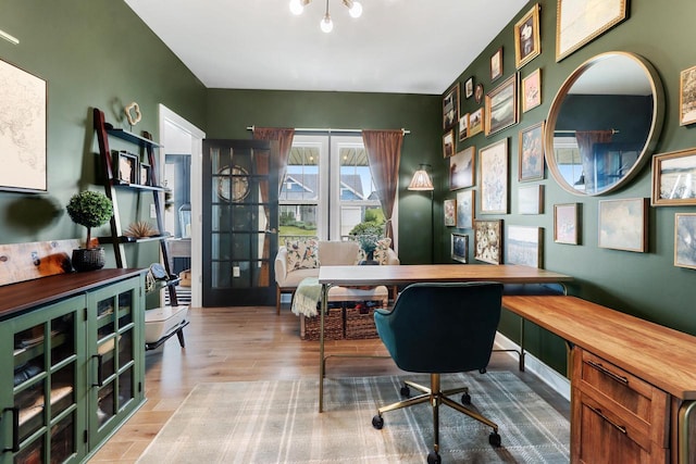 office area with light hardwood / wood-style flooring