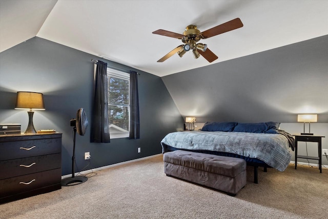 carpeted bedroom featuring vaulted ceiling and ceiling fan