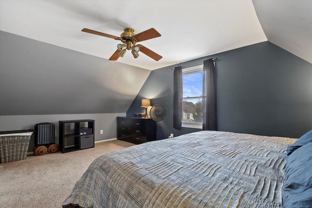 bedroom with ceiling fan, light colored carpet, and vaulted ceiling