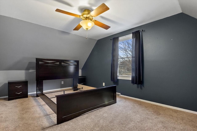 bedroom with ceiling fan, light colored carpet, and lofted ceiling