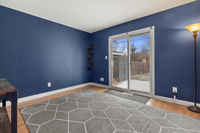 unfurnished room featuring hardwood / wood-style floors