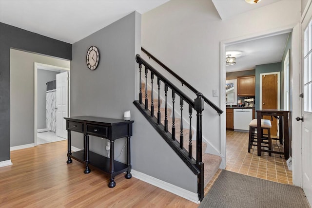 staircase featuring hardwood / wood-style floors