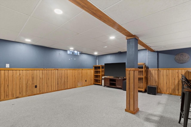 basement featuring light colored carpet