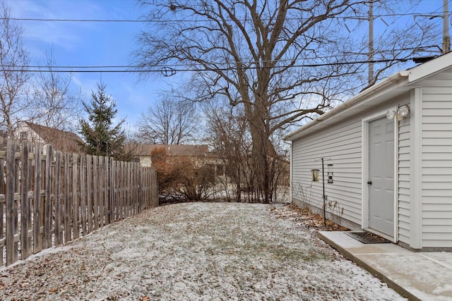 view of yard layered in snow