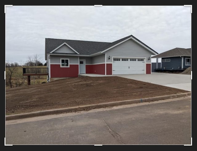 ranch-style home featuring a garage