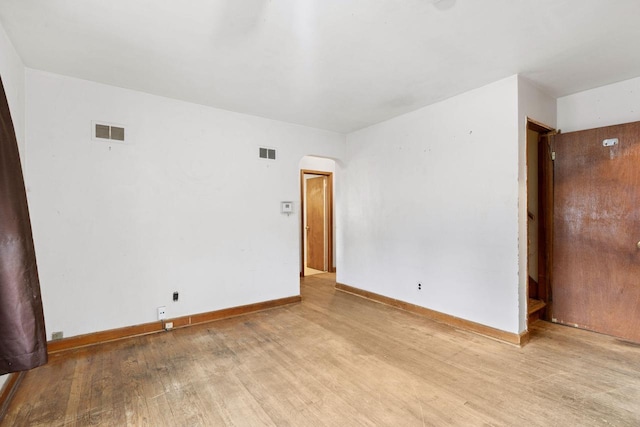 empty room with light hardwood / wood-style floors