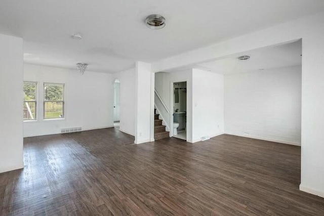 empty room featuring dark wood-type flooring