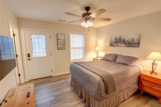 bedroom featuring ceiling fan and hardwood / wood-style floors