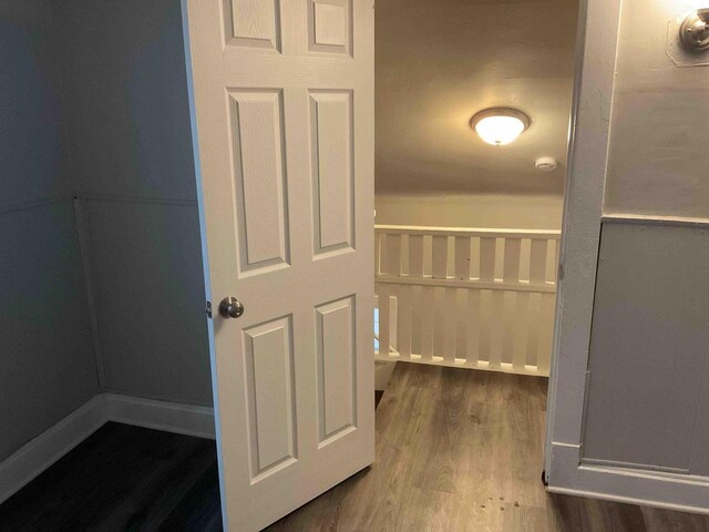 corridor featuring hardwood / wood-style floors