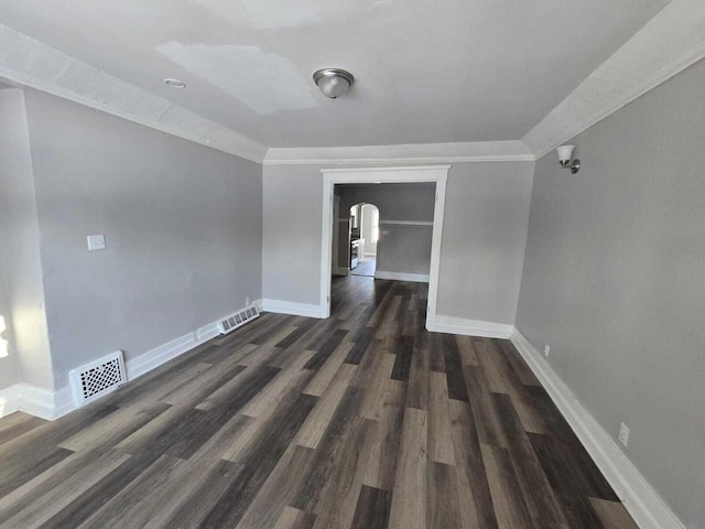 empty room with dark hardwood / wood-style flooring