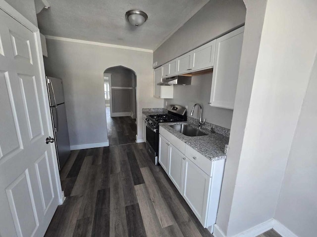 kitchen featuring sink, light stone countertops, dark hardwood / wood-style flooring, white cabinetry, and stainless steel appliances