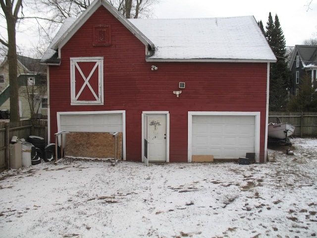 view of snow covered garage