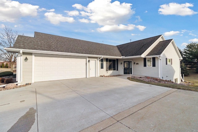 ranch-style home featuring a garage