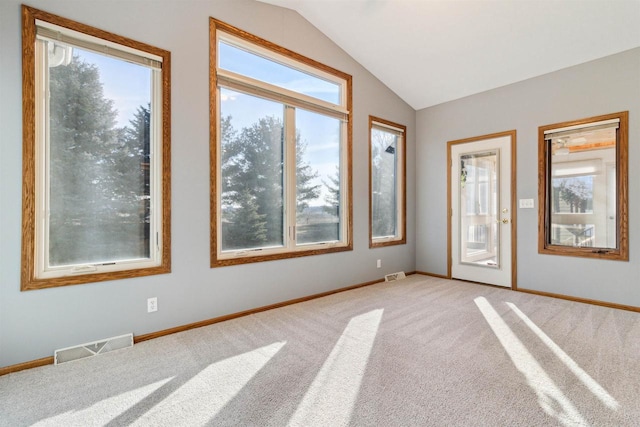 unfurnished sunroom featuring a wealth of natural light and lofted ceiling