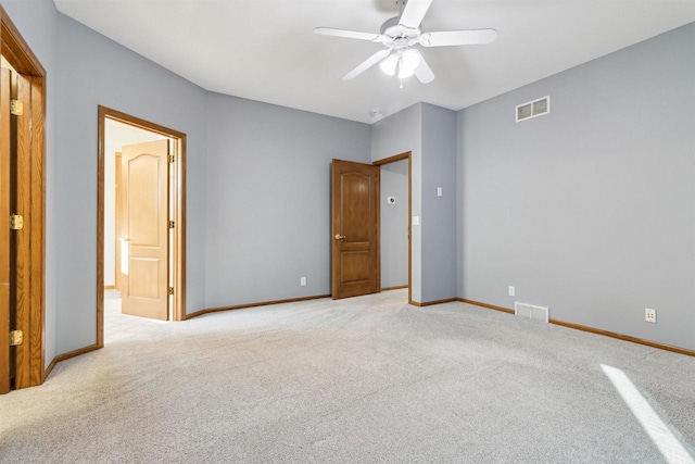 unfurnished bedroom featuring light carpet and ceiling fan