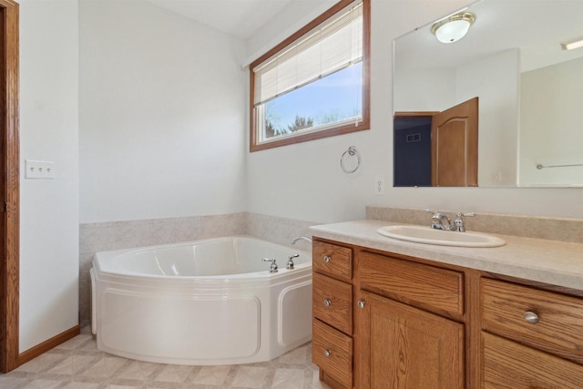 bathroom with vanity and a bathtub