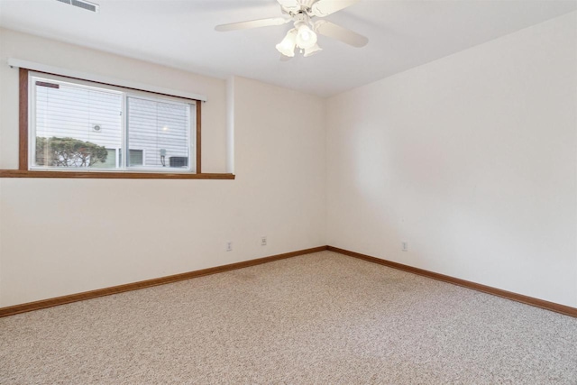 empty room with carpet flooring and ceiling fan