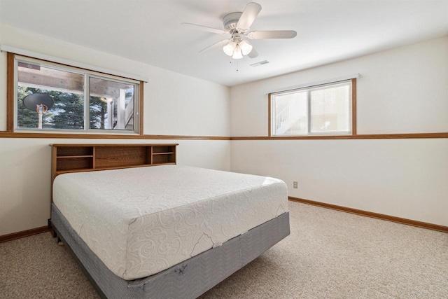 bedroom with ceiling fan and carpet floors