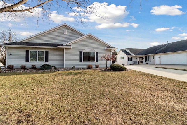 ranch-style house with a front yard and a garage