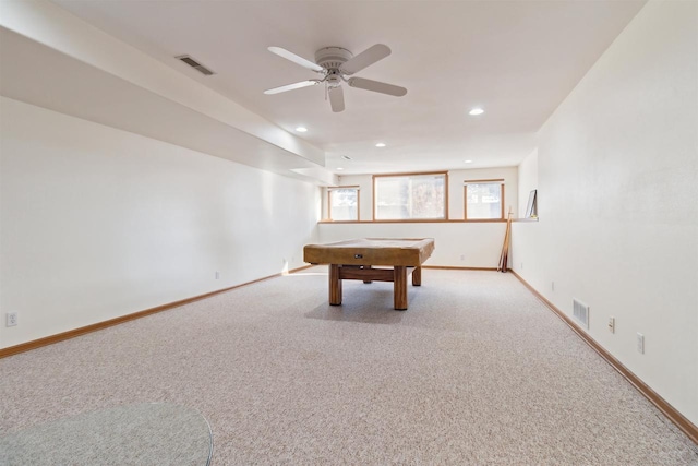 rec room featuring light carpet, ceiling fan, and pool table