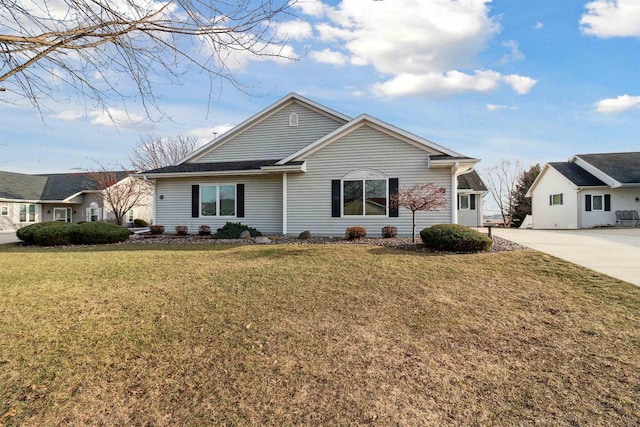 ranch-style home featuring a front yard