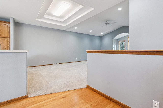 spare room with light hardwood / wood-style floors and ceiling fan