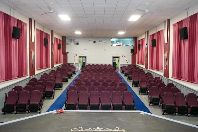 cinema room with ceiling fan