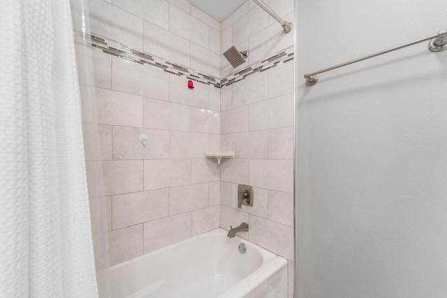 bathroom featuring shower / bathtub combination with curtain