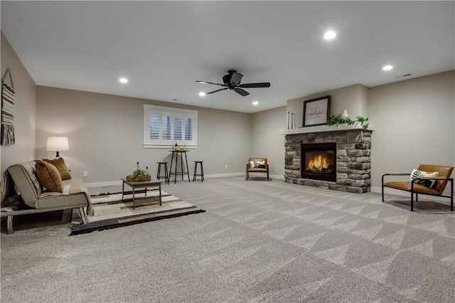 living area featuring recessed lighting, baseboards, carpet, and a fireplace