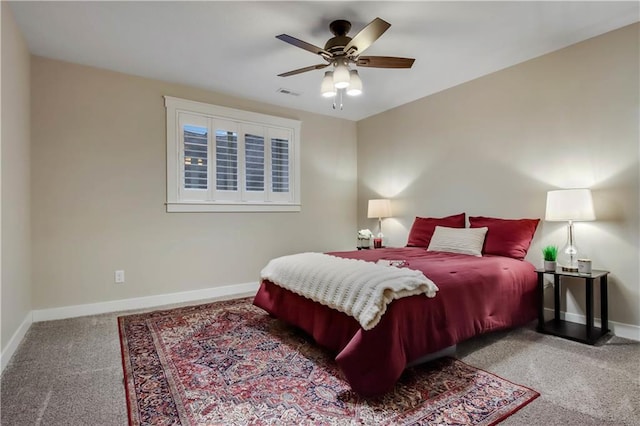 bedroom with visible vents, baseboards, carpet, and a ceiling fan