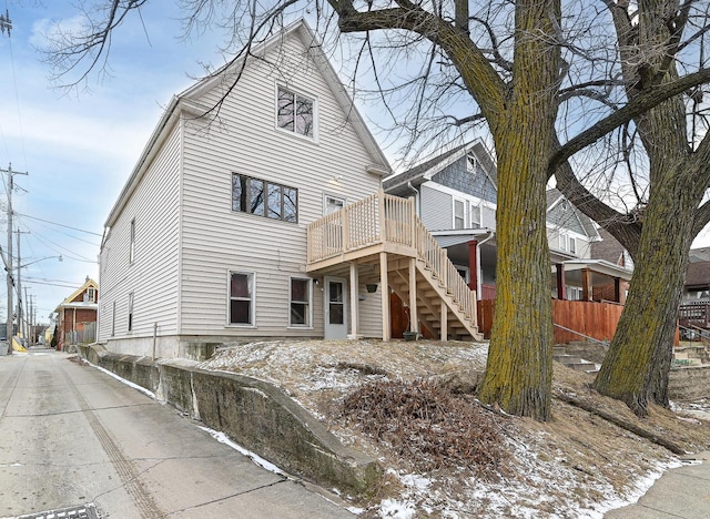 view of snow covered rear of property