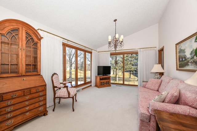 carpeted living room featuring a notable chandelier, a textured ceiling, and vaulted ceiling