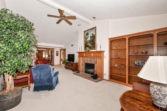 carpeted living room featuring vaulted ceiling with beams, ceiling fan, a textured ceiling, and a brick fireplace