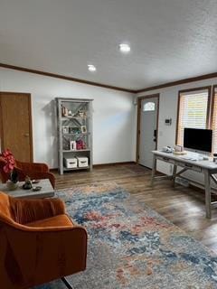 living room featuring wood-type flooring and crown molding