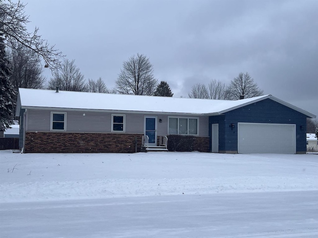 ranch-style house featuring a garage